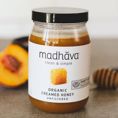 Madhava Organic Honey label close-up showing purity and certifications