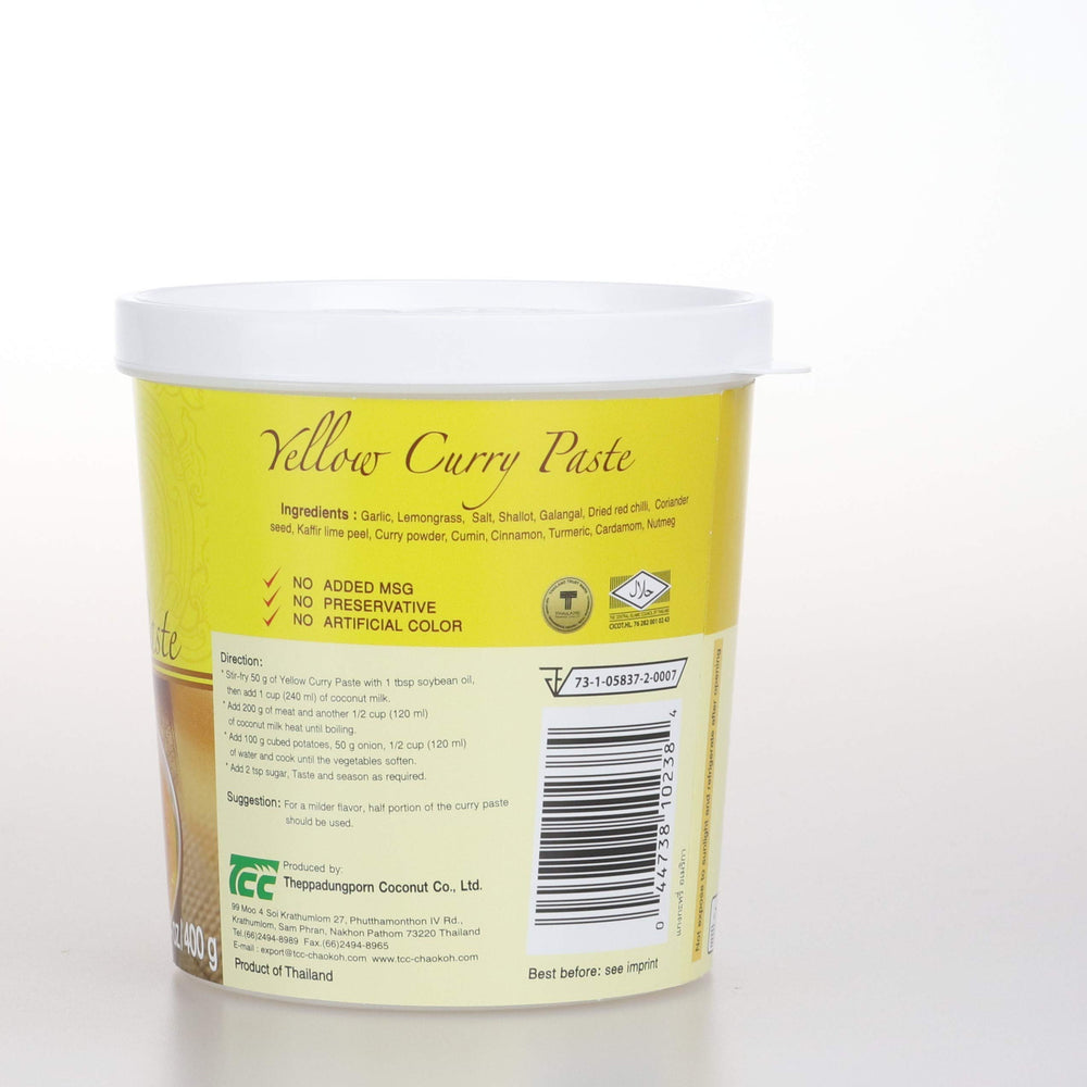 Mae Ploy paste bottle beside measuring tool for portions.