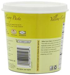 Mae Ploy Yellow curry paste in a curry simmer scene showing vibrant color and aroma.