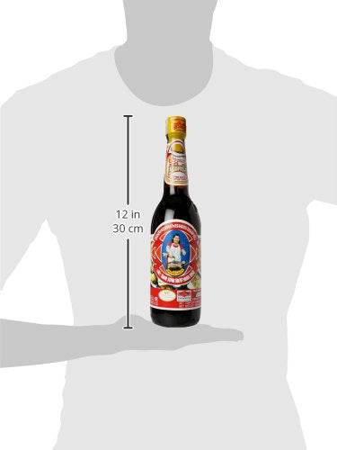 Maekrua Oyster Sauce in cooking scene shows versatile glaze for vegetables and meats.