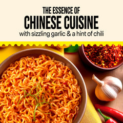 Maggi noodles closeup with red chili flakes highlighting balanced heat and garlic flavor.