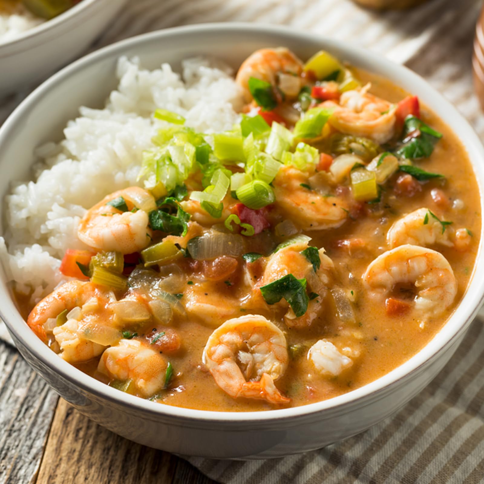 Gumbo File powder in bowl creates a smooth, flavorful gravy base.