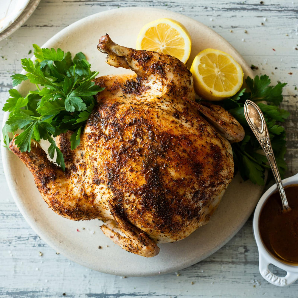 Poultry Magic Seasoning sprinkled on pan-seared chicken for flavor.