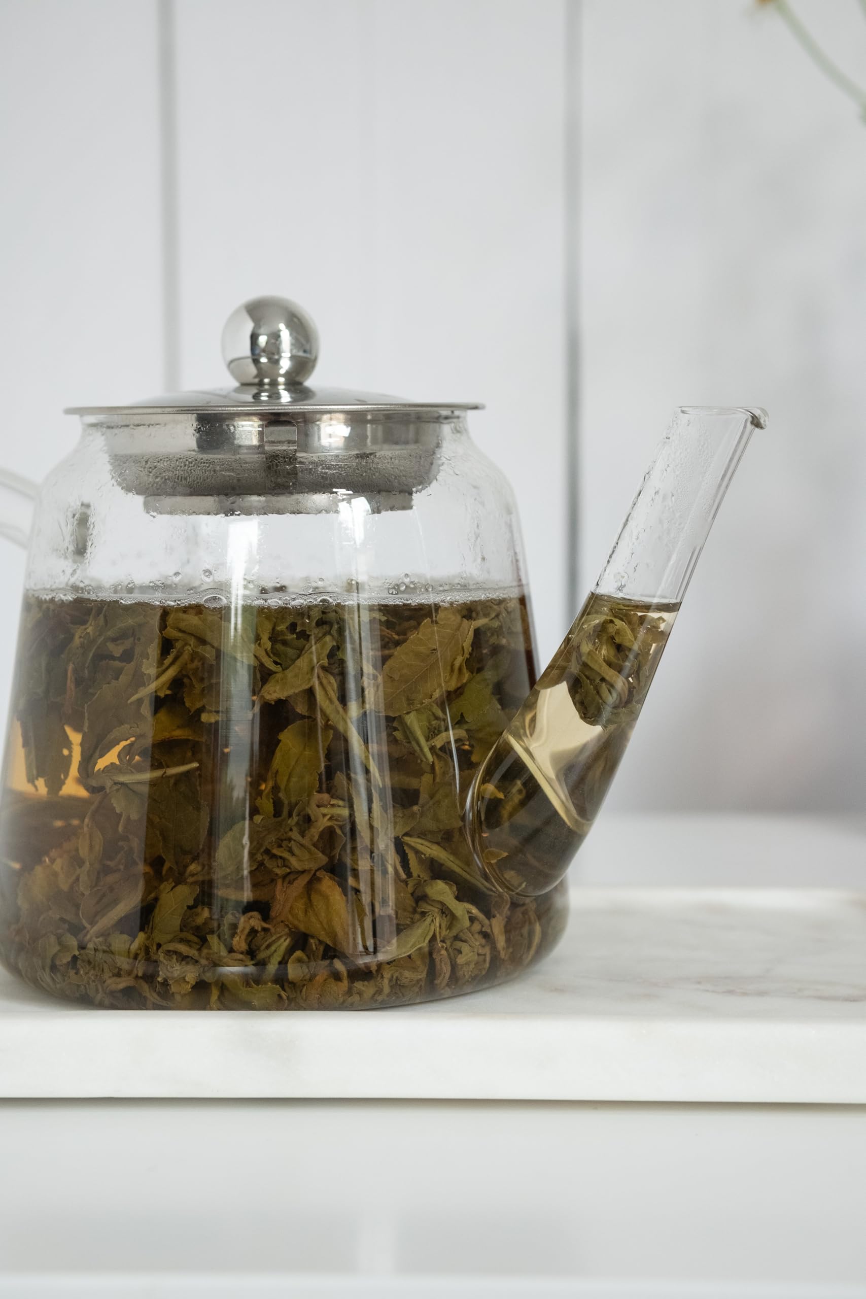 Green tea leaves used in MagJo Jasmine Dragon Pearls