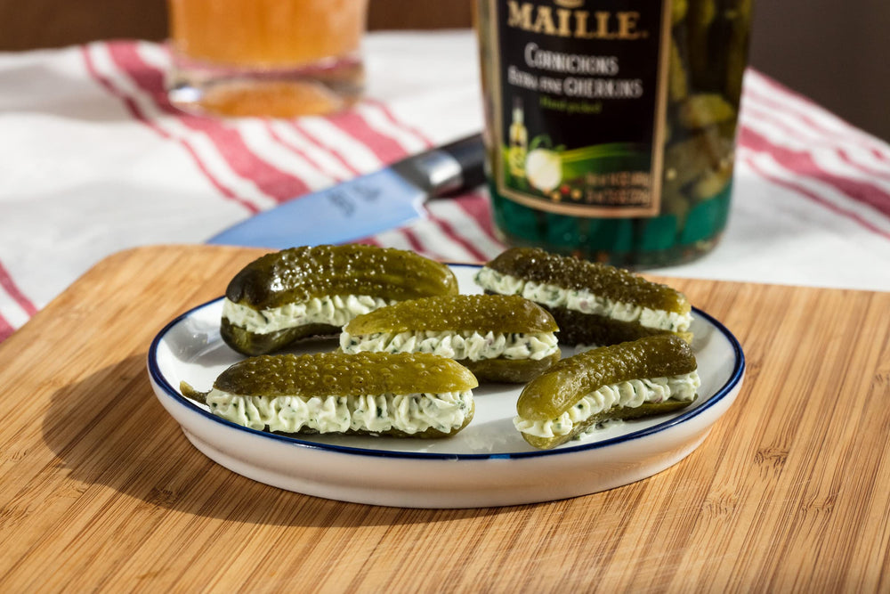 Maille cornichons original on cheese board for texture and tang