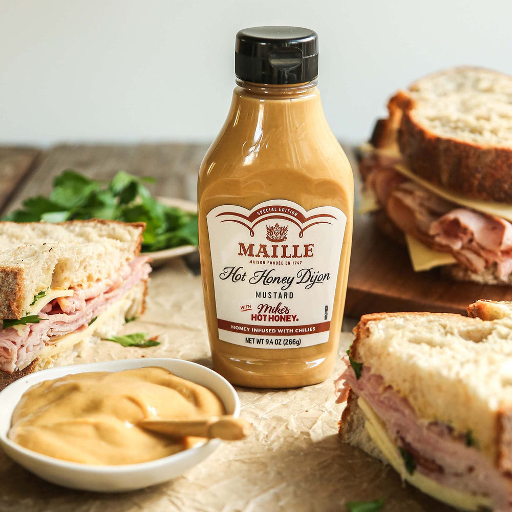 Sandwich topped with Maille x Mike's Hot Honey Dijon for tangy kick