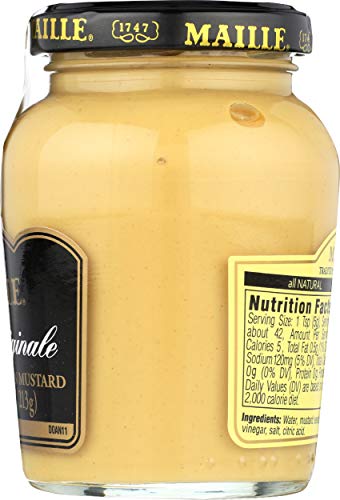 Maille Dijon mustard seeds closeup emphasizes finely crushed grains