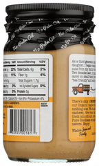 Spoonful of Maisie Jane's Cashew Butter on apple demonstrates snack-friendly versatility.