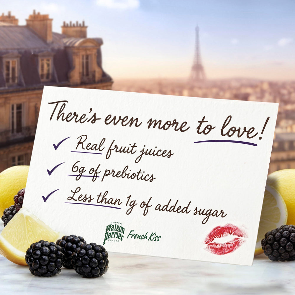 Maison Perrier French Kiss glass highlighting 6g prebiotic fiber per can for wellness.