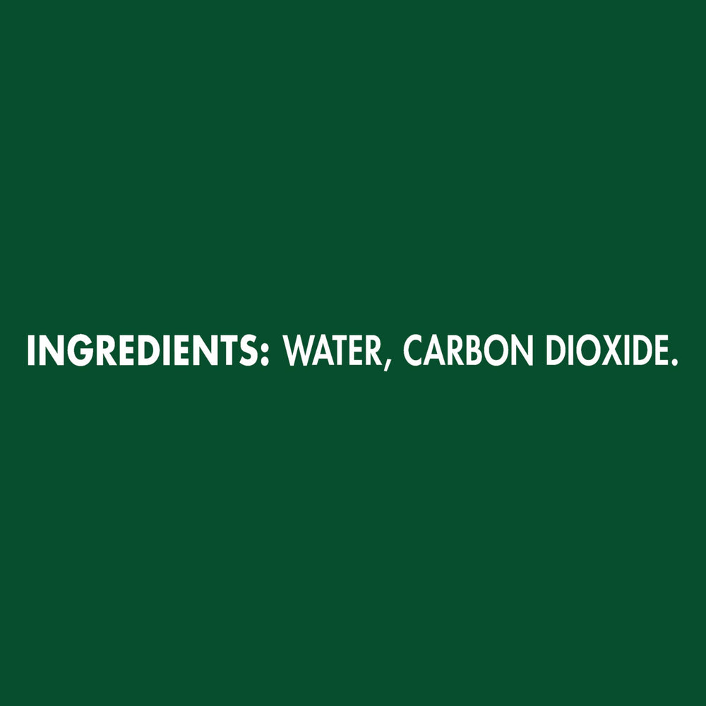 Bubbles rising in a glass of Maison Perrier Ultimate sparkling water.