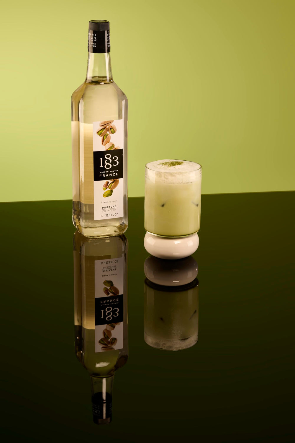 1883 Pistachio Syrup dessert drizzle enhancing ice cream.