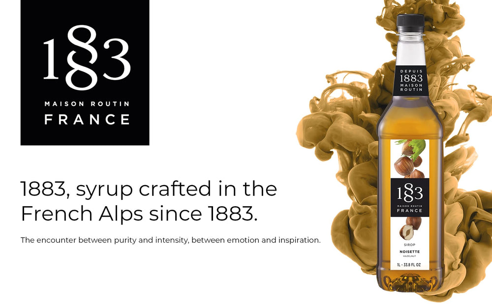 1883 MAISON ROUTIN hazelnut syrup being poured into a latte