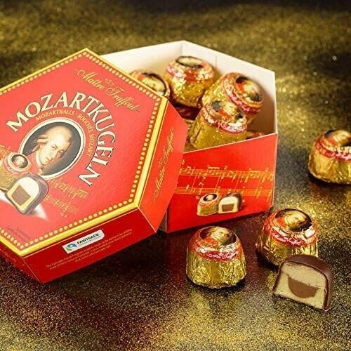 Close-up of glossy chocolate coating on Mozart balls.