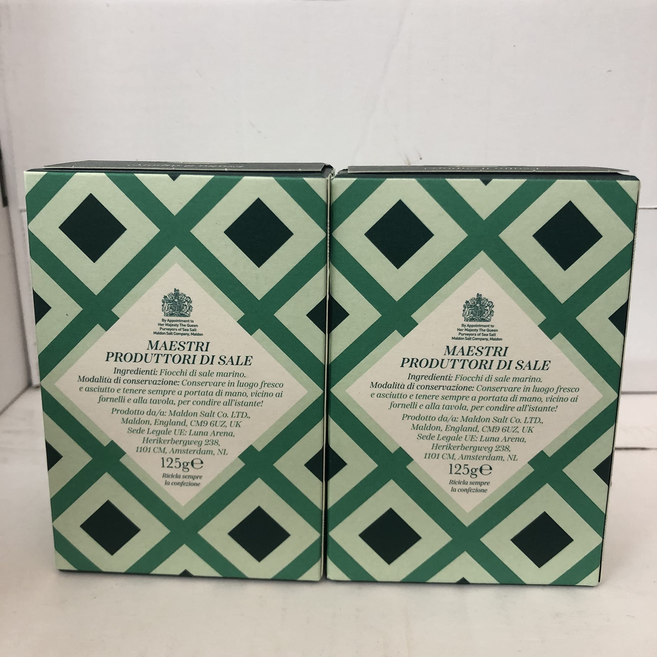 Two Maldon packs on a kitchen counter, premium finishing salt for meals.