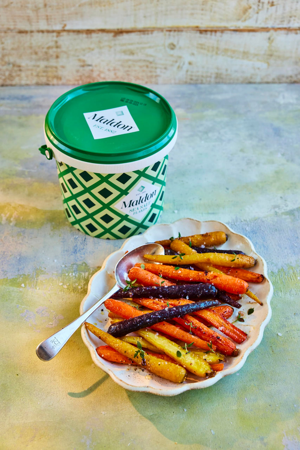 Maldon Sea Salt Flakes finishing on grilled vegetables for bright crunch