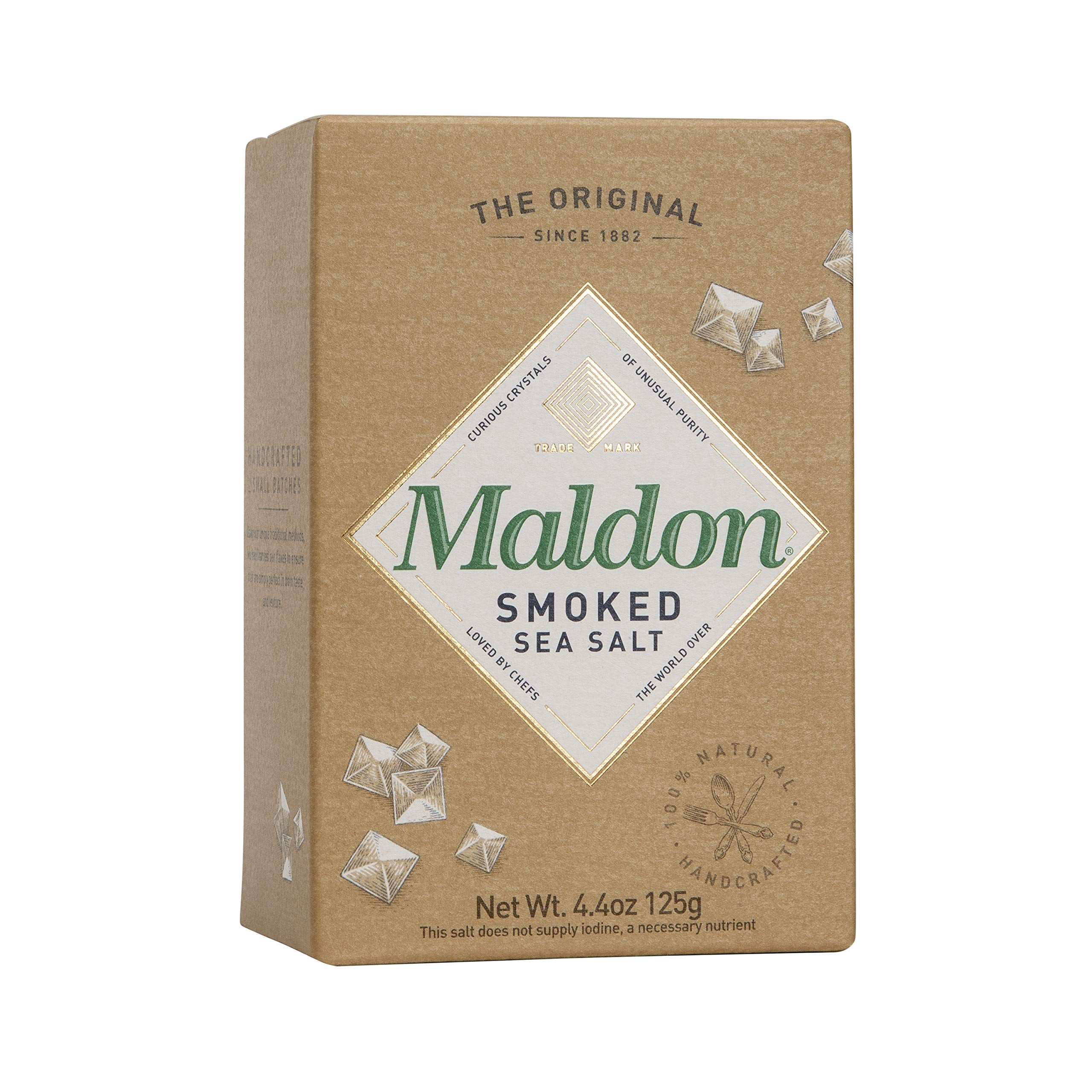 Maldon smoked sea salt flakes on chicken, subtly enhancing savoriness