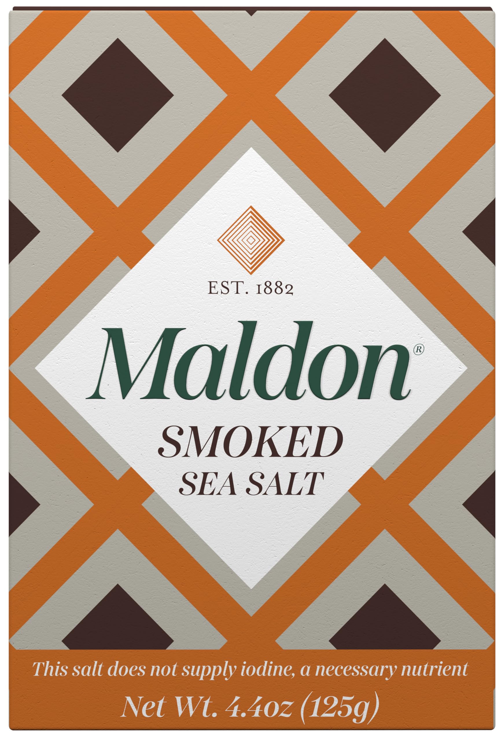 Maldon smoked sea salt flakes close-up; pyramid texture for seafood finishing.