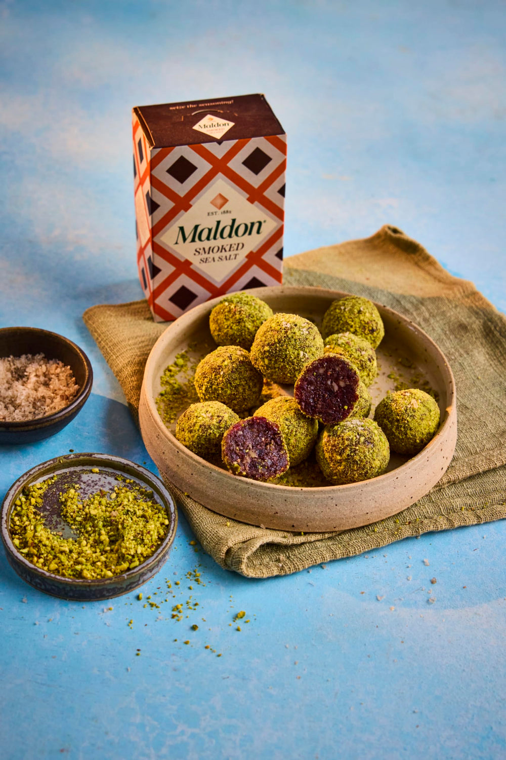 Maldon smoked sea salt flakes on steamed vegetables, balanced smoky touch