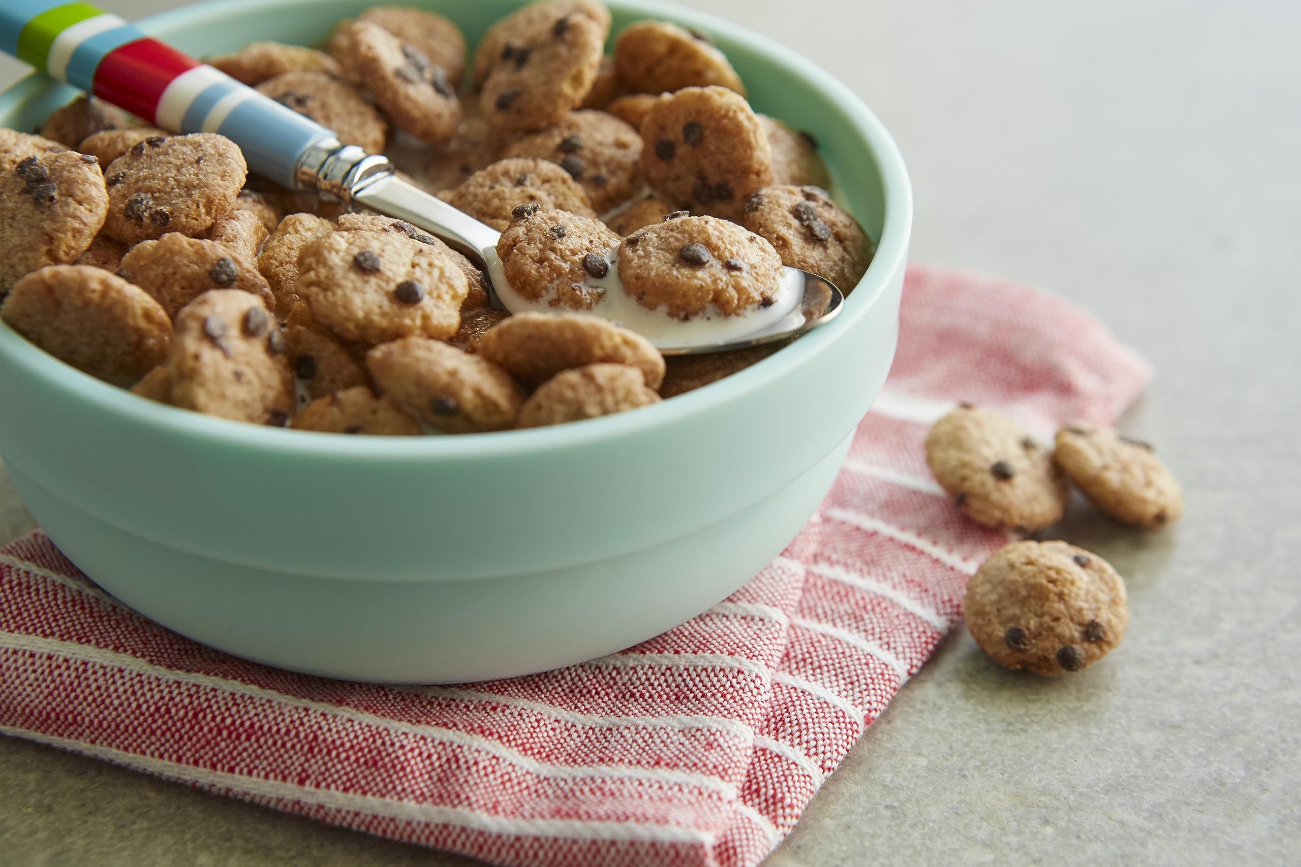 Malt-O-Meal Chocolatey Chip Cookie Bites in milk, kid-friendly cereal pairing.