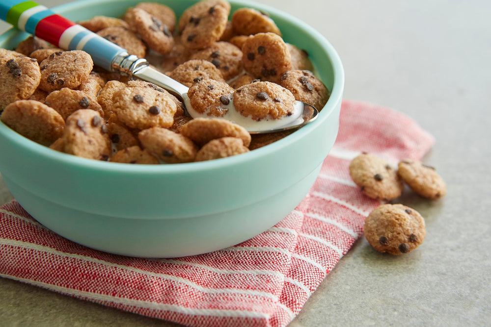 Malt-O-Meal Chocolatey Chip Cookie Bites in milk, kid-friendly cereal pairing.