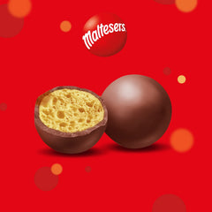 Maltesers Celebration 650g closeup candies, crisp chocolate shells and airy centers.
