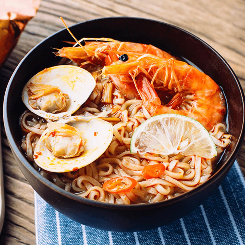 MAMA ramen shrimp creamy tom yum cooking with steaming noodles highlights bold flavor