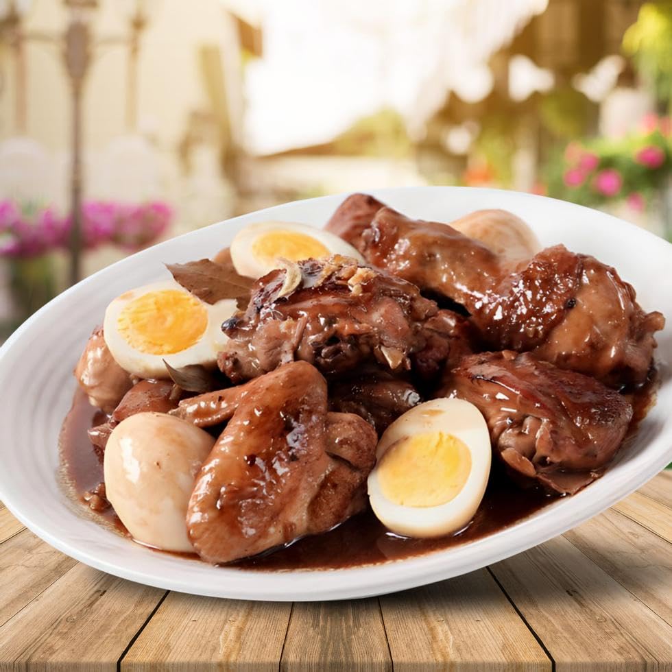Mama Sita's Adobo cooked dish plated with rice and aroma.