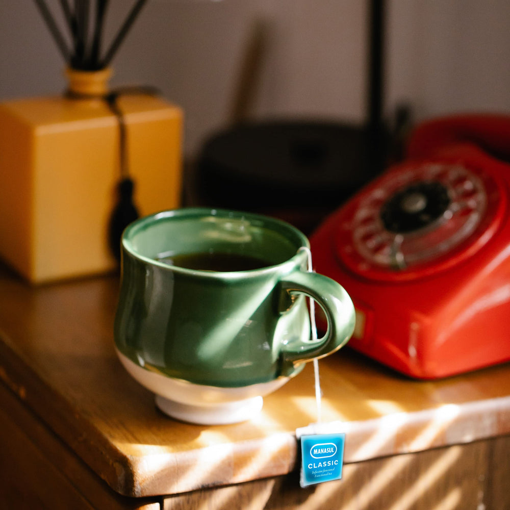 MANASUL Classic brewed tea in cup with calming aroma.