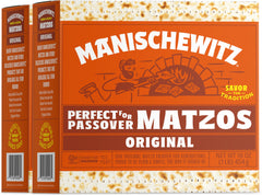 Manischewitz matzos fresh and crispy on a board, ready for spreads and toppings.