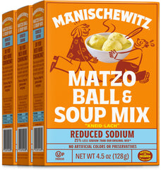 Manischewitz reduced-sodium matzo ball soup mix in a bowl with fluffy matzo balls