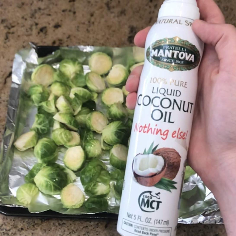 Mantova oil spray finishing a salad dressing with shine
