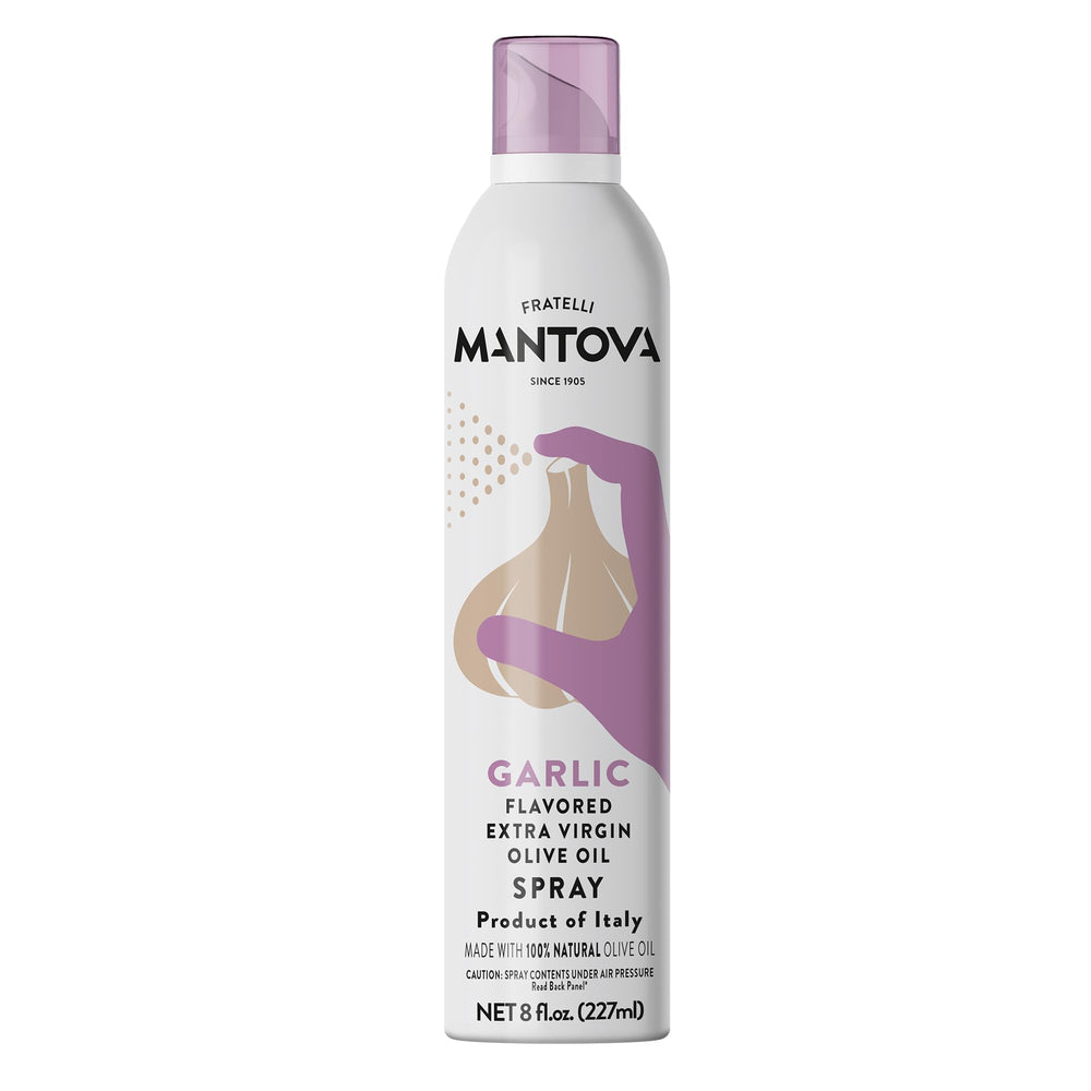 Mantova Garlic Flavored EVOO Spray bottle pouring a light drizzle on dish