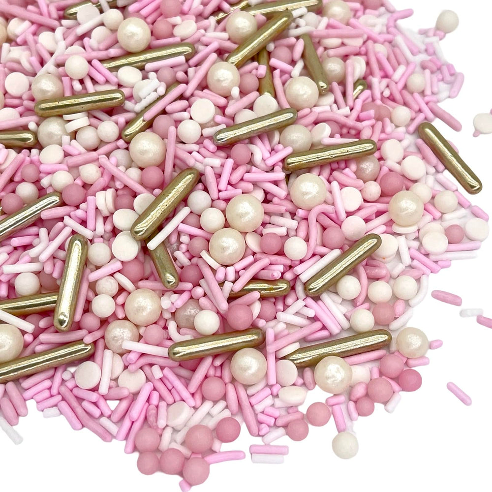 Manvscakes pink rose sprinkles elevate macarons and desserts with shine.