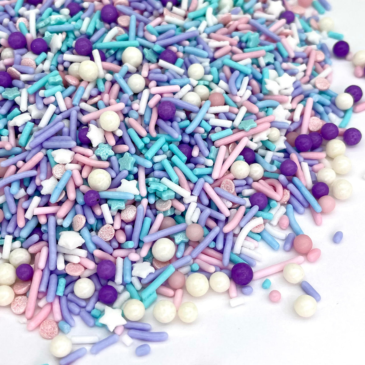 Manvscakes pink blue themed sprinkles brighten desserts for festive celebrations.