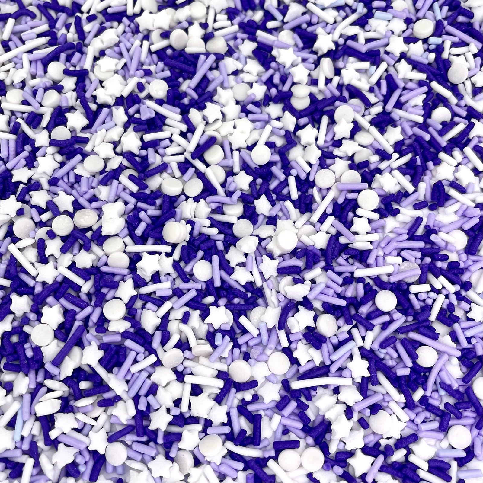 Close-up of Manvscakes sprinkles featuring jimmies and nonpareils for rich texture.