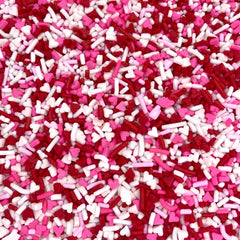Manvscakes Valentine sprinkles on cakes and cookies adding color and sparkle.