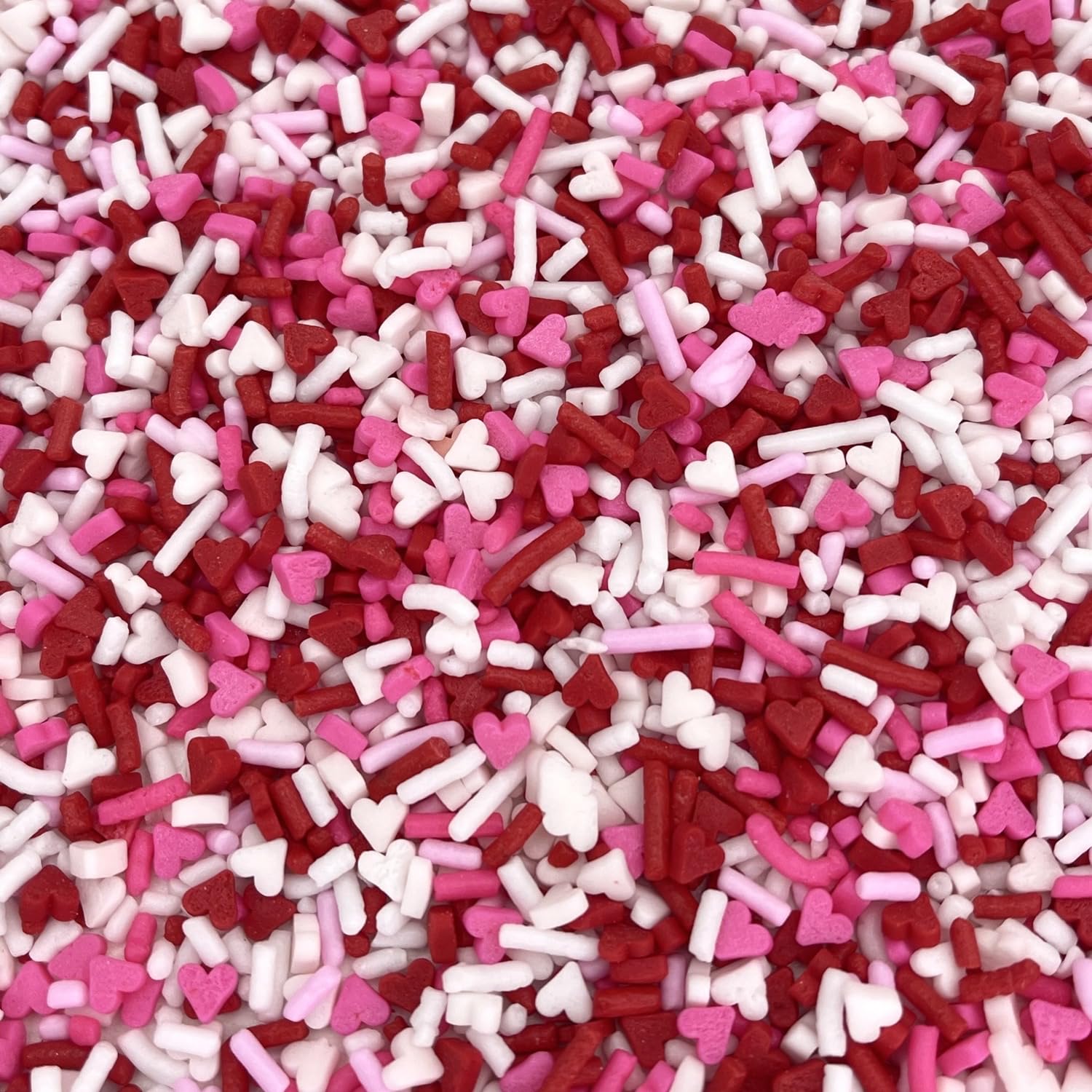 Manvscakes Valentine sprinkles on ice cream and donuts for bright desserts.