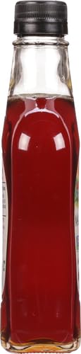 Glass bottle of Maple Grove Farms syrup, label visible