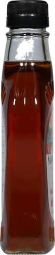 Glass bottle of Maple Grove Farms syrup with rich color.