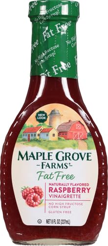 Maple Grove Farms raspberry vinaigrette in a glass bowl on greens.