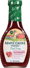 Maple Grove Farms raspberry vinaigrette in a glass bowl on greens.