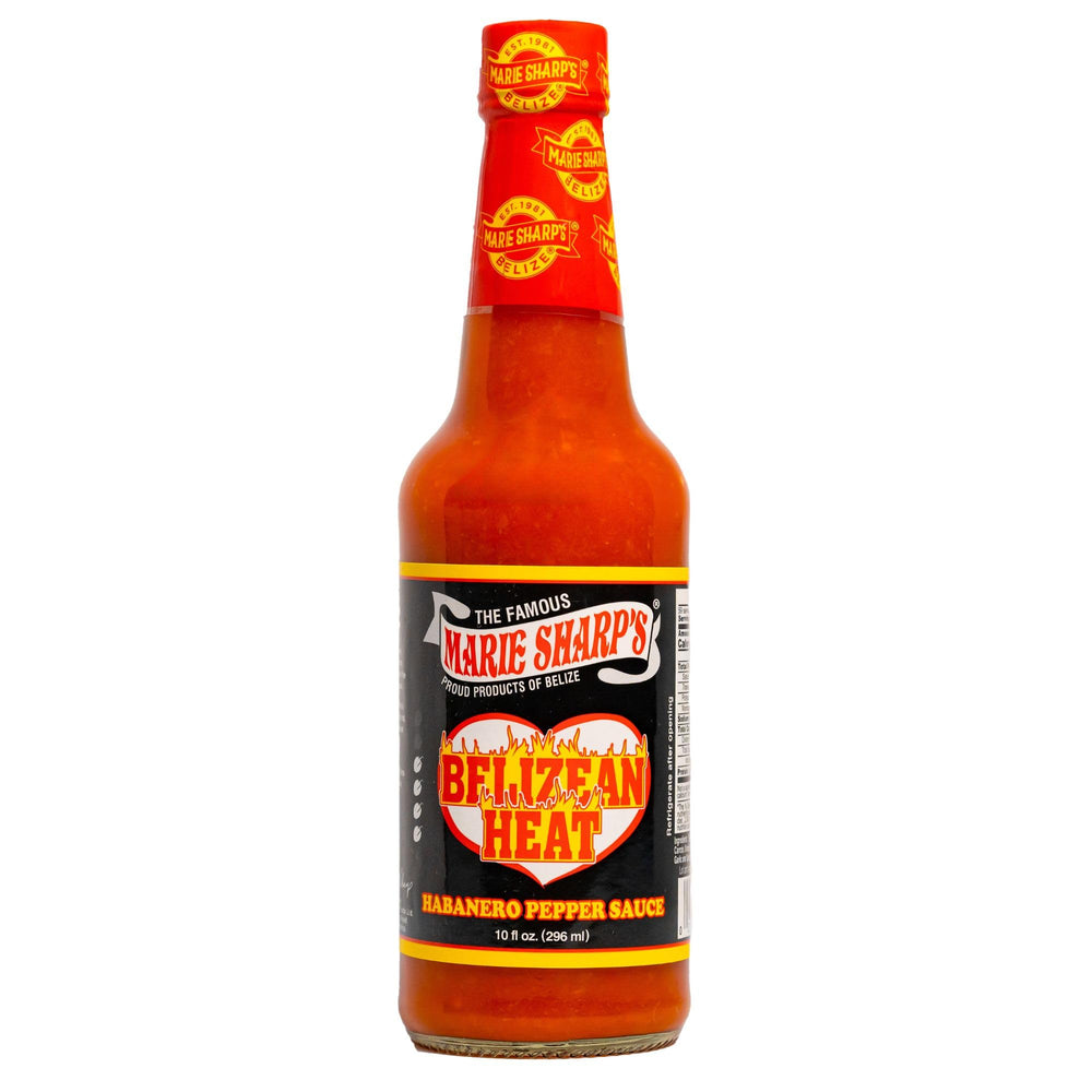 Marie Sharp's Belizean Heat habanero sauce bottle on wood, bold flavor ready.