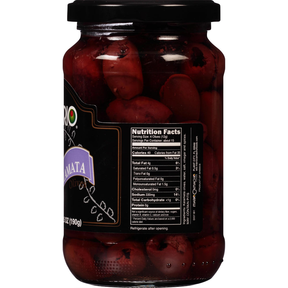 Olives on a charcuterie board with color and savory depth from Mario Camacho.