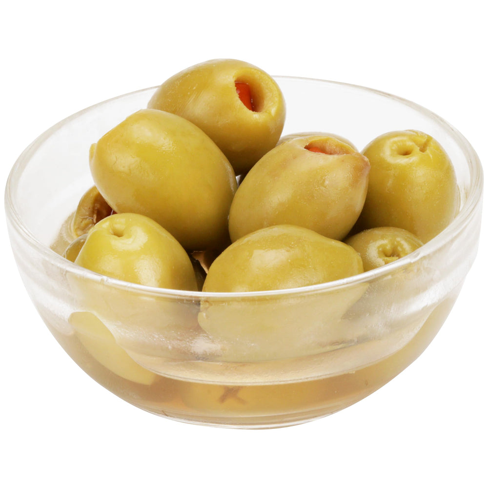 Gourmet snack: Mario Camacho Queen Olives stuffed with minced pimiento on a cheese board.