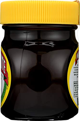 Marmite bottle pouring onto toast for a quick flavor boost
