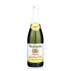 Martinelli's Sparkling Cider bottle pour captures crisp apple bubbles for festive moments.