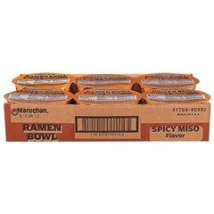 Closeup of Maruchan Bowl Spicy Miso shows fiery seasoning and colorful vegetables for flavor.