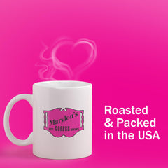 Marylou's Banana Nut Bread on kitchen counter beside a mug for morning brew.