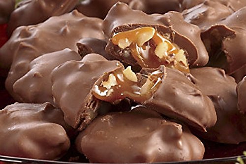 Mascot Pecan Clusters with caramel center in a resealable tub, preserves freshness.