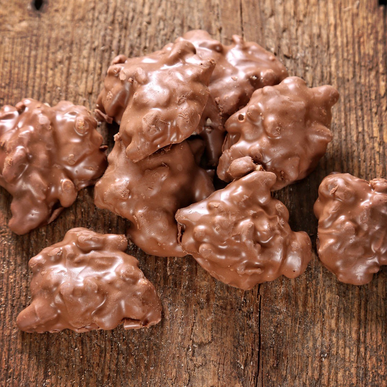 Mascot Pecan Clusters in a 1.25-pound tub, easy to share at gatherings.